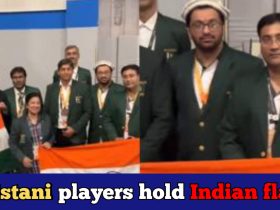 Pakistani chess players celebrate Indian victory holding the tricolour