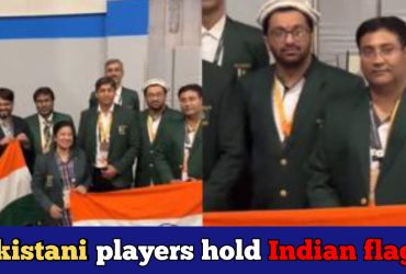 Pakistani chess players celebrate Indian victory holding the tricolour